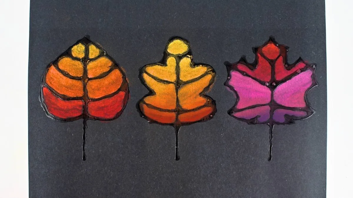Feuilles d’automne colorées au pastel sur papier noir